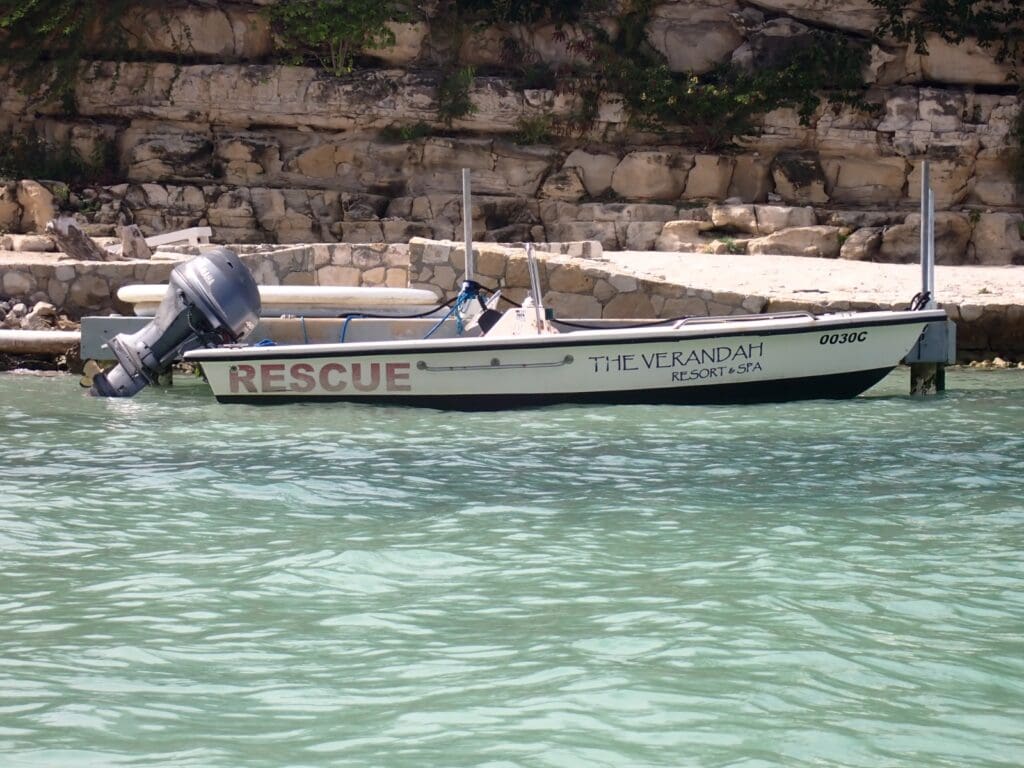 Rescue boat assisting a flipped kayak in the ocean, symbolizing support during divorce, emotional overwhelm, and the importance of not navigating divorce alone