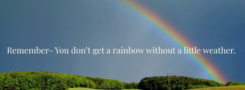 Rainbow after a storm over green landscape symbolizing hope, healing, and new beginnings during divorce recovery and life transitions